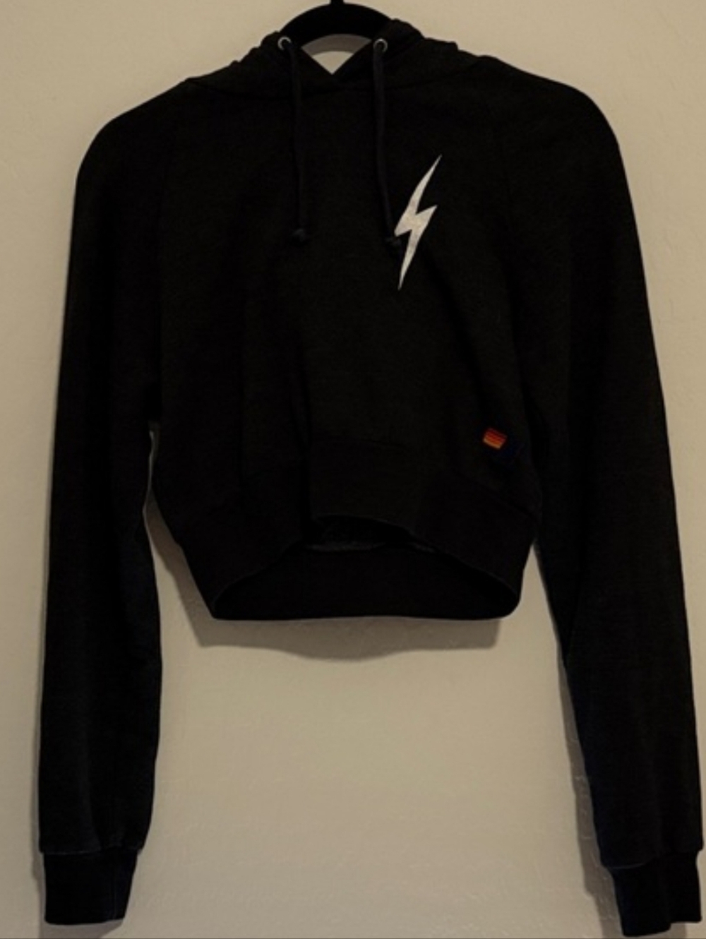 PRE-OWNED Aviator Nation Black Cropped Hoodie with White Lightning Bolt